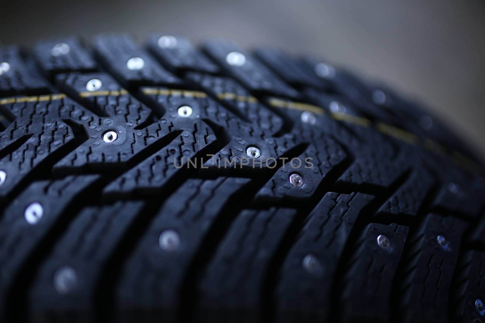 Studded tire on a background