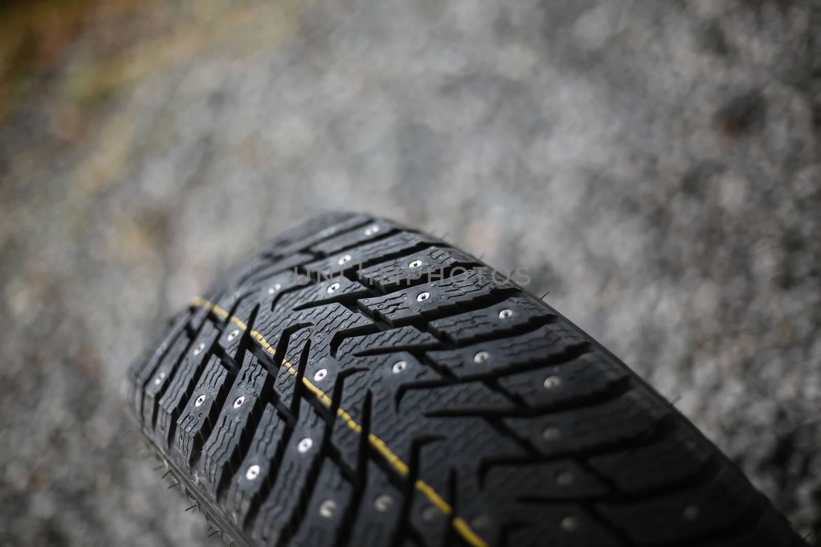 Studded tire on a background