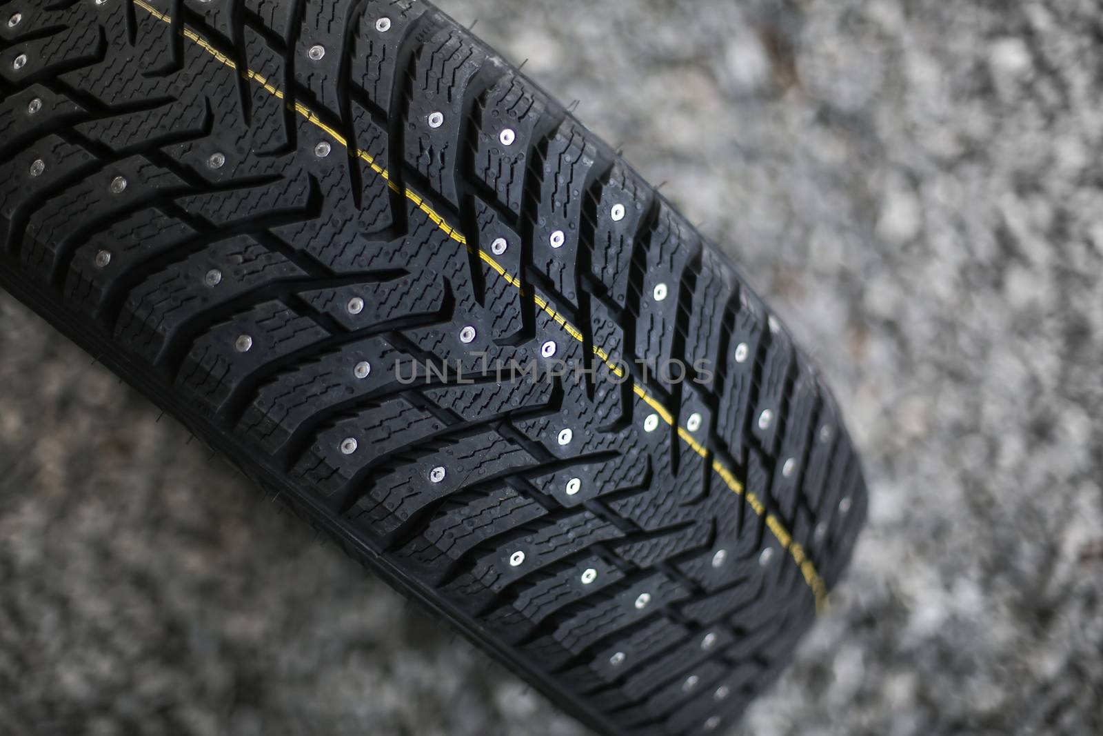 Studded tire on a background