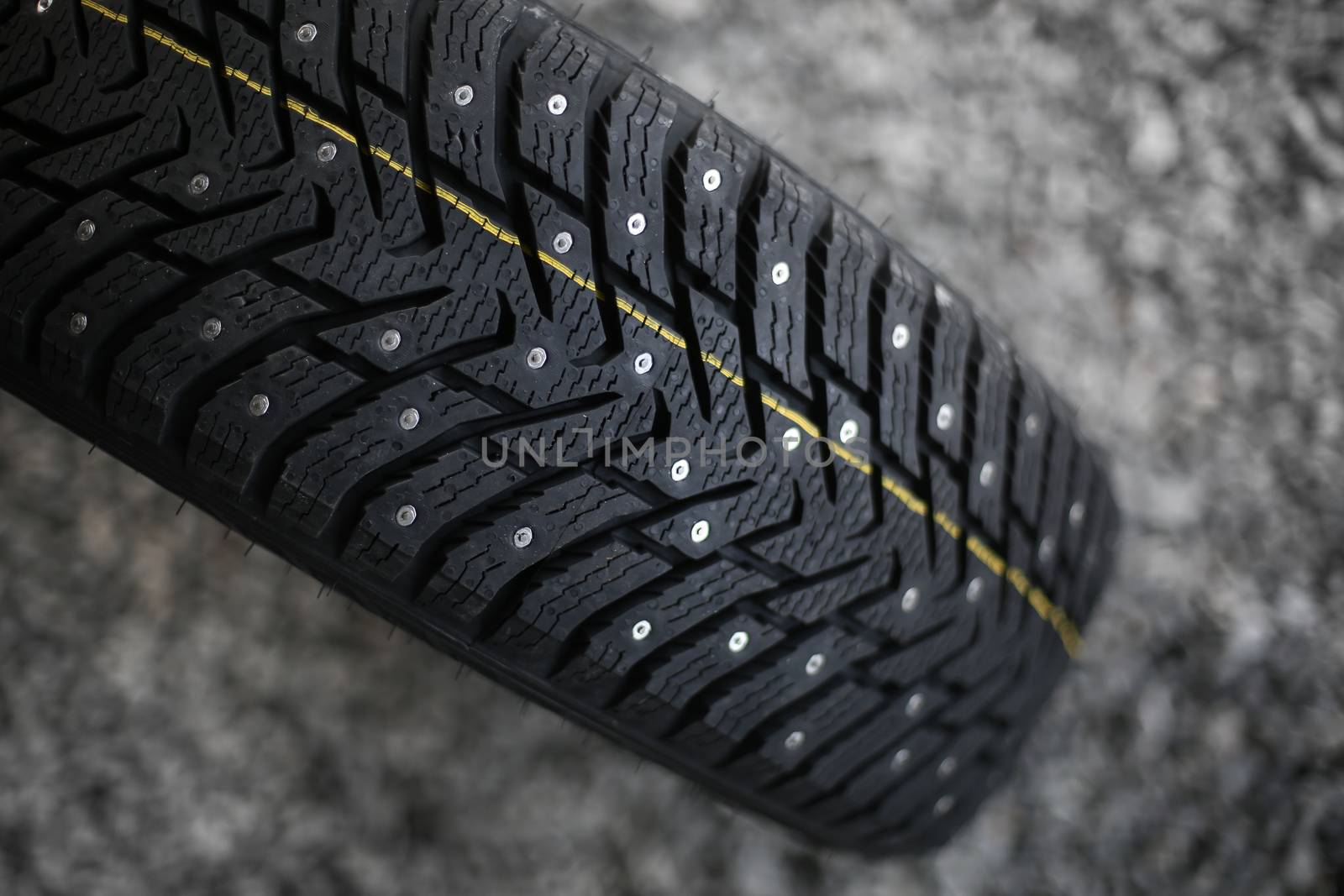 Studded tire on a background