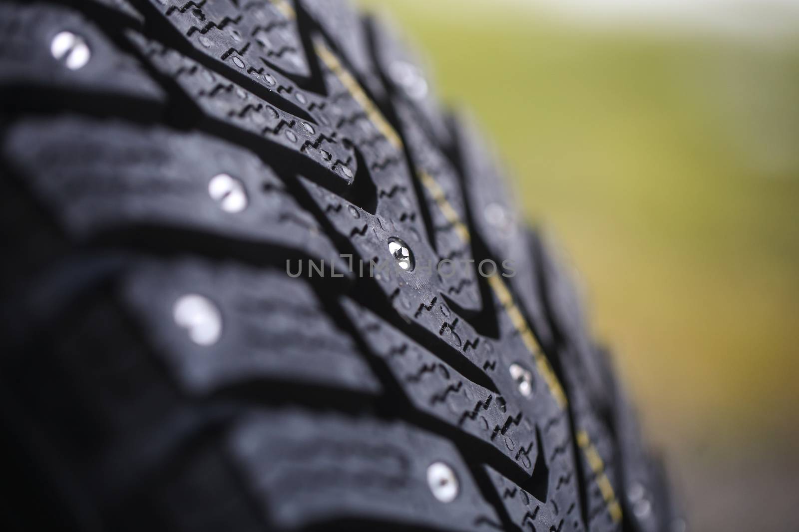 Studded tire on a background