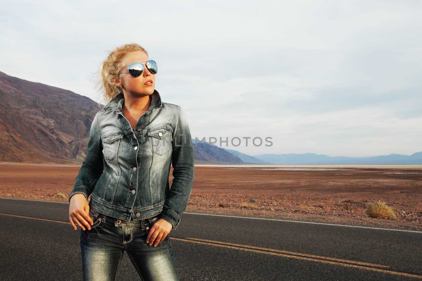 portrait of young beautiful girl in sunset road environment