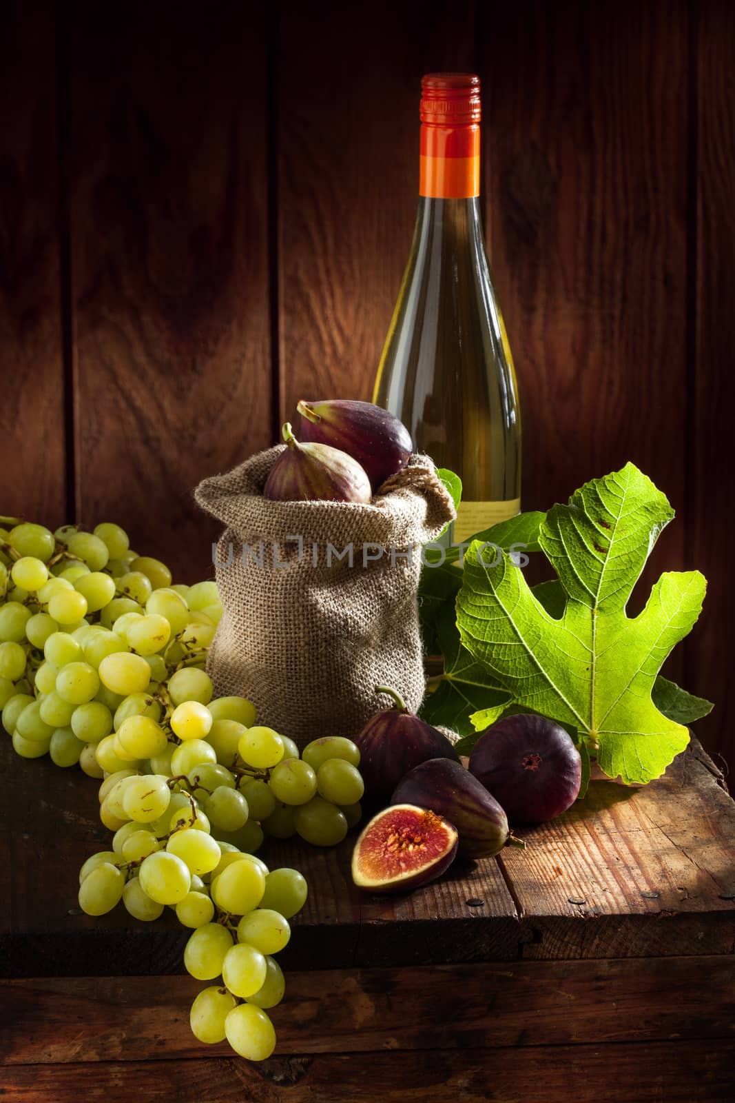 close up view of fresh figs and grape  on color back