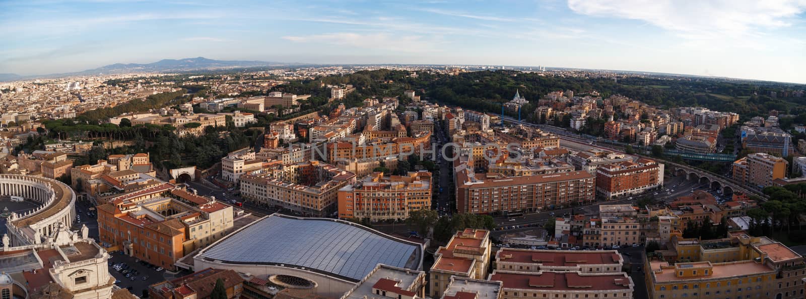 Top view of Vatican City from the dome of St. Peter's Basilica in Italy, on cloudy sky background.