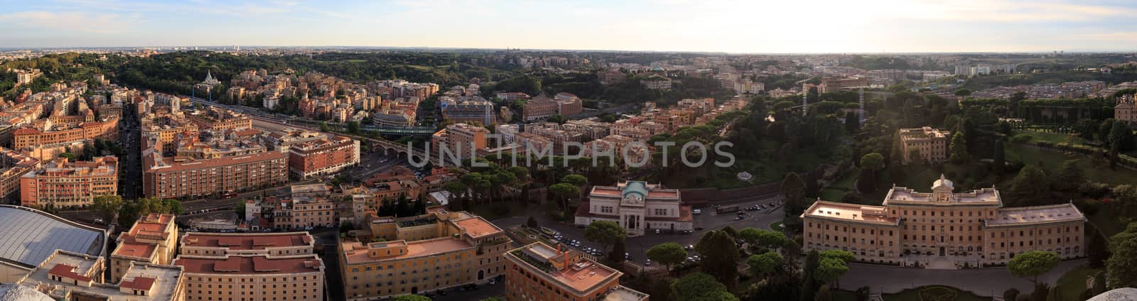 Top view of Vatican City from the dome of St. Peter's Basilica in Italy, on cloudy sky background.