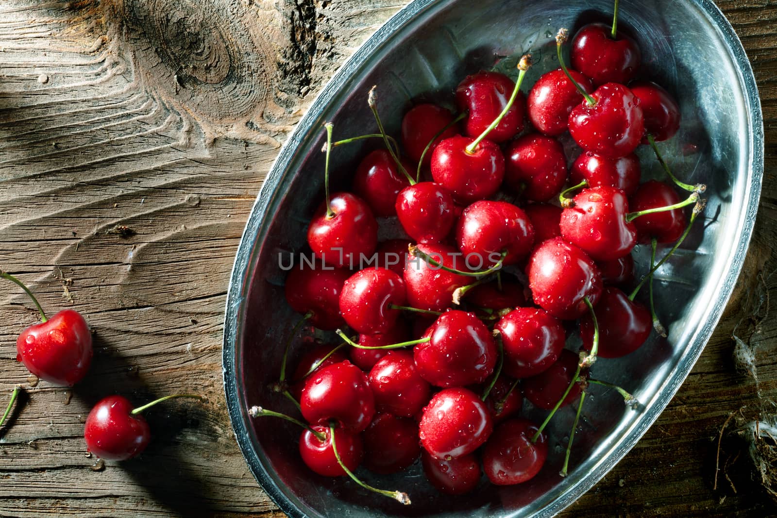 close up view of fresh cherry on color back