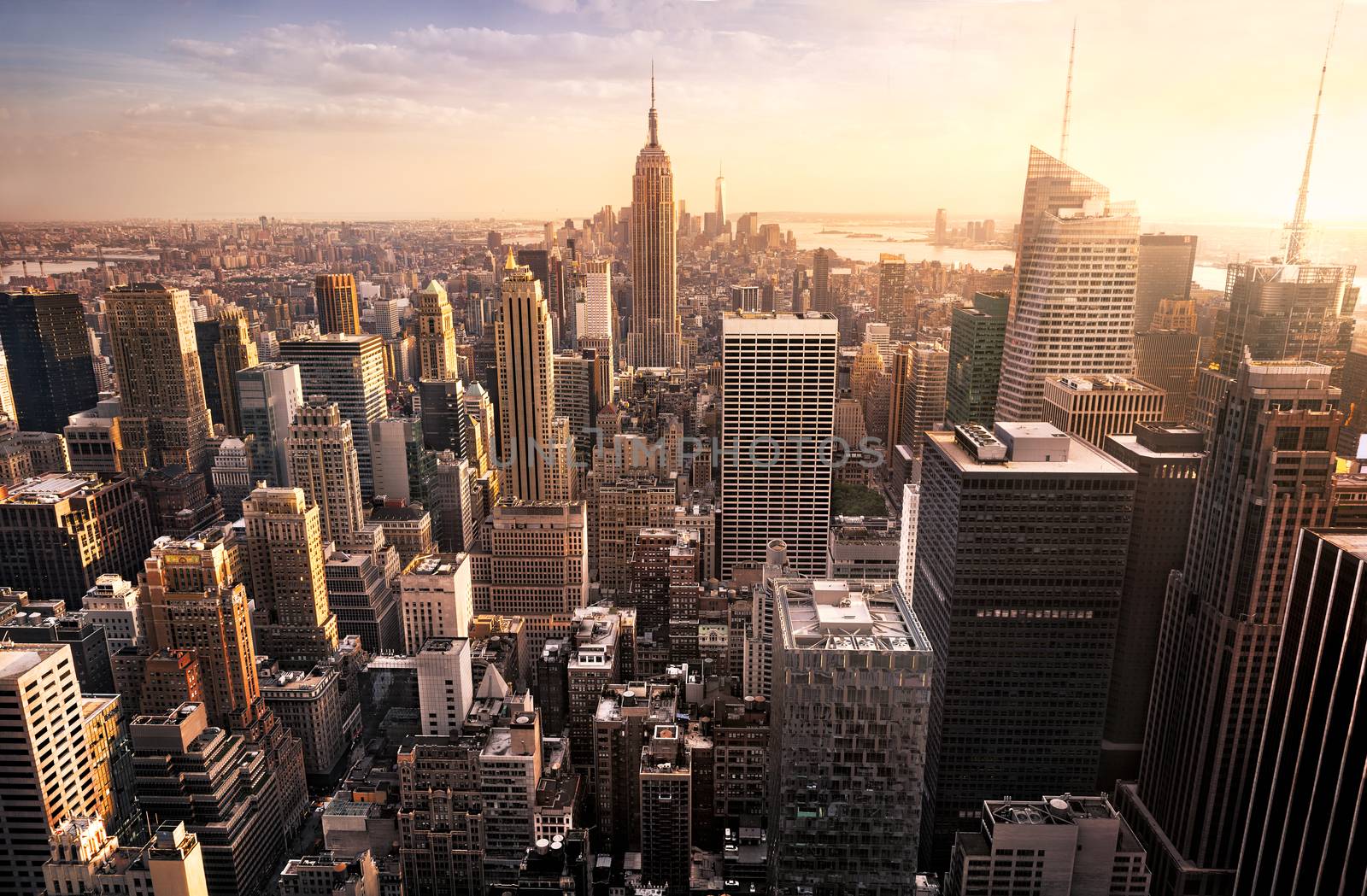New York City skyline with urban skyscrapers at sunset, USA.