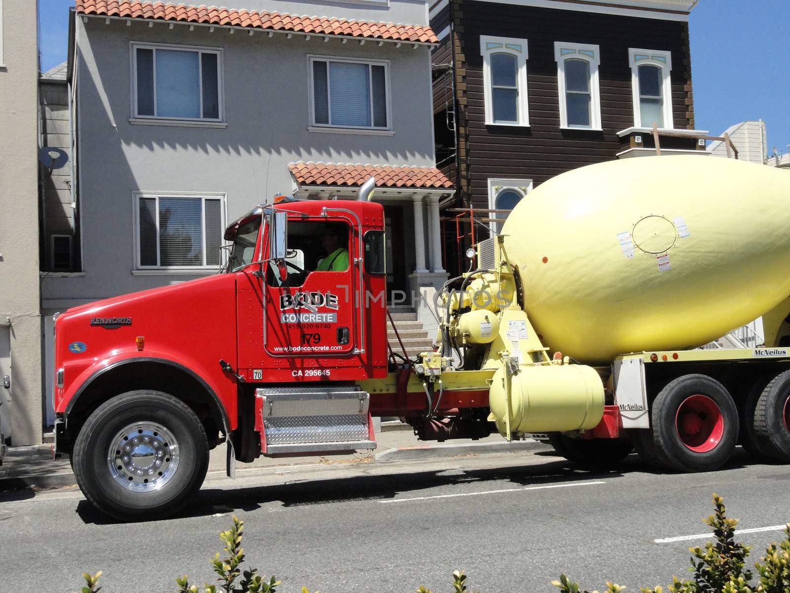 San Francisco, USA - July 22 2010: Red Kenworth Concrete Mixer Truck in the streets of San Francisco, California