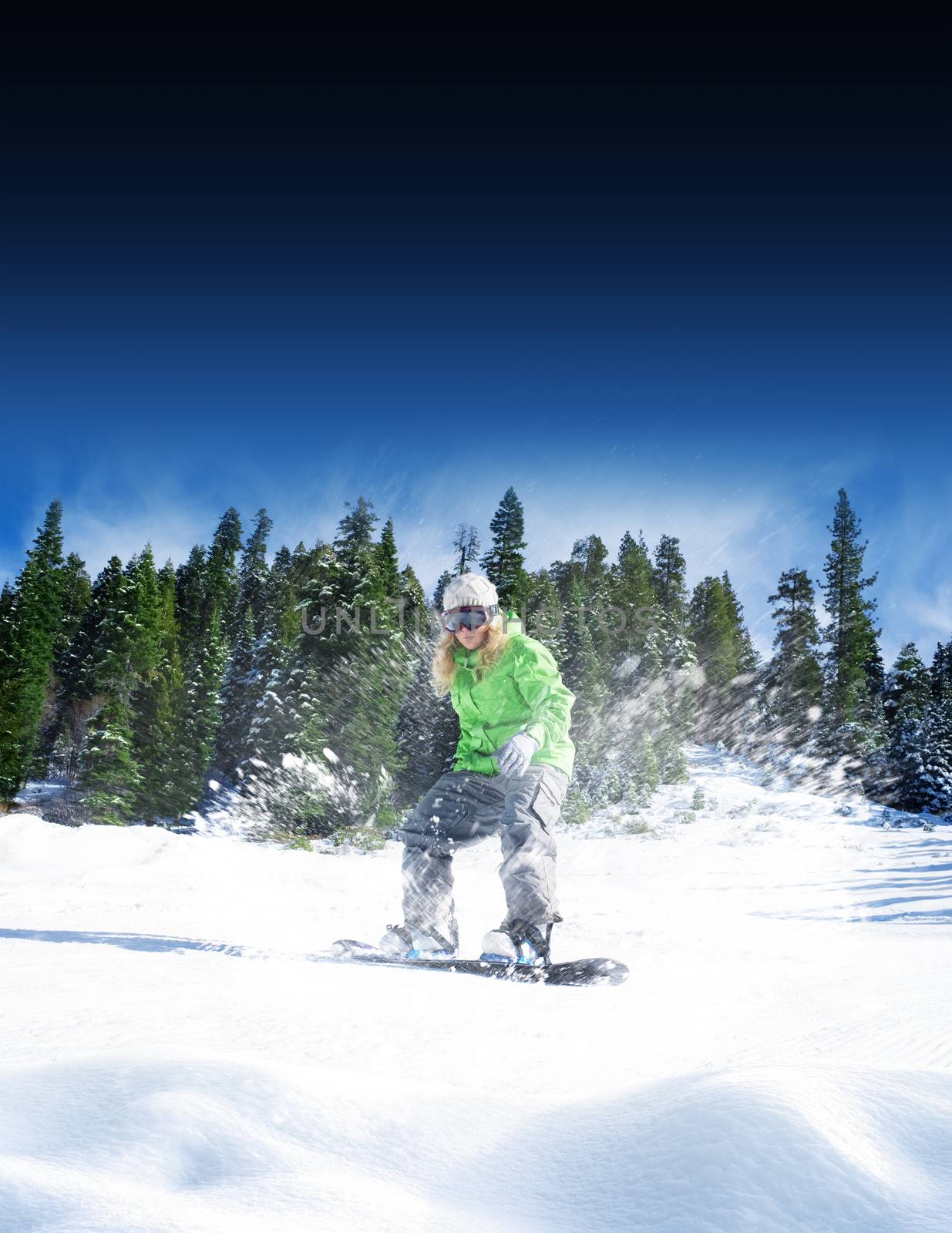 view of a young girl snowboarding in winter environment