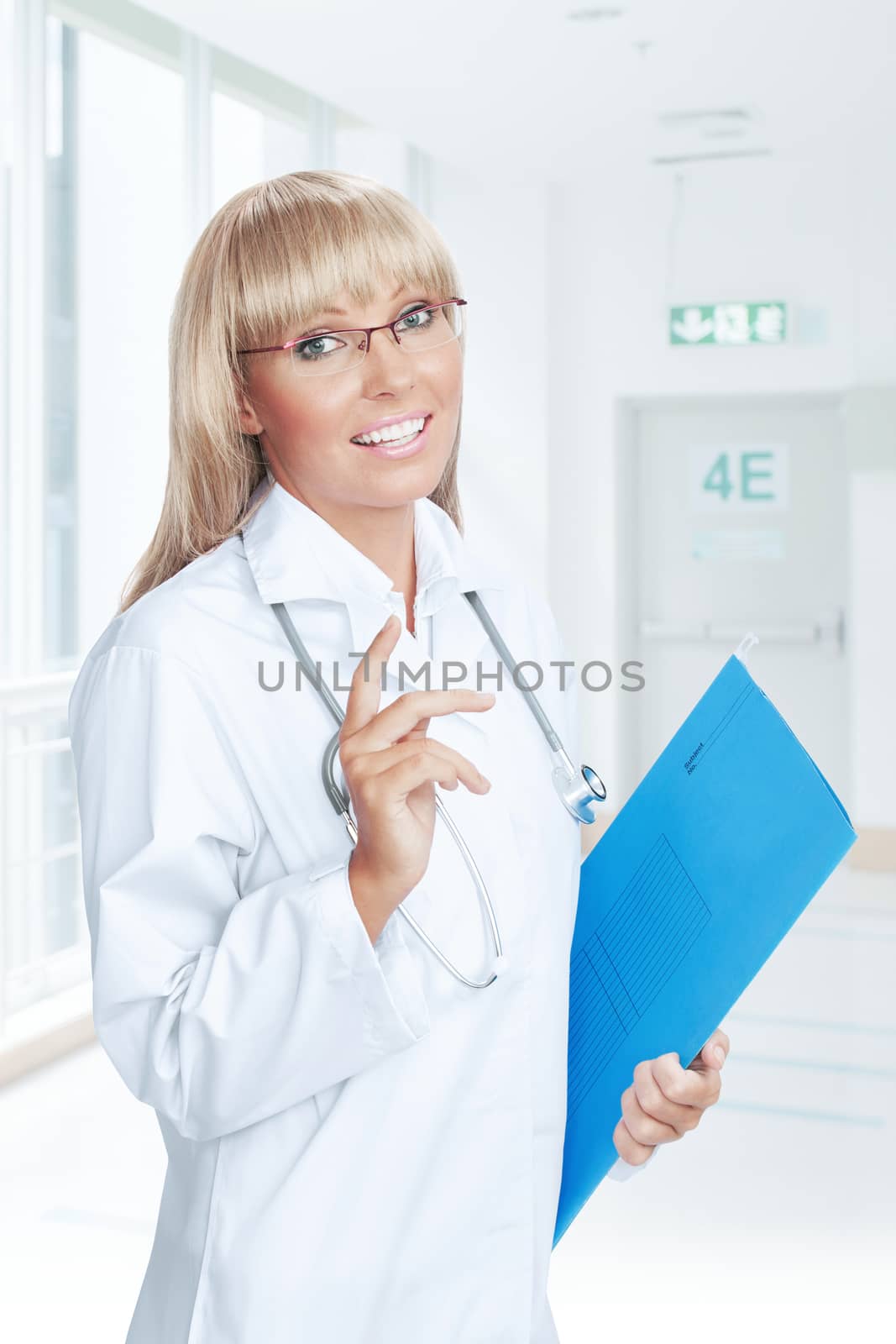 Portrait of nice doctor  on color  back