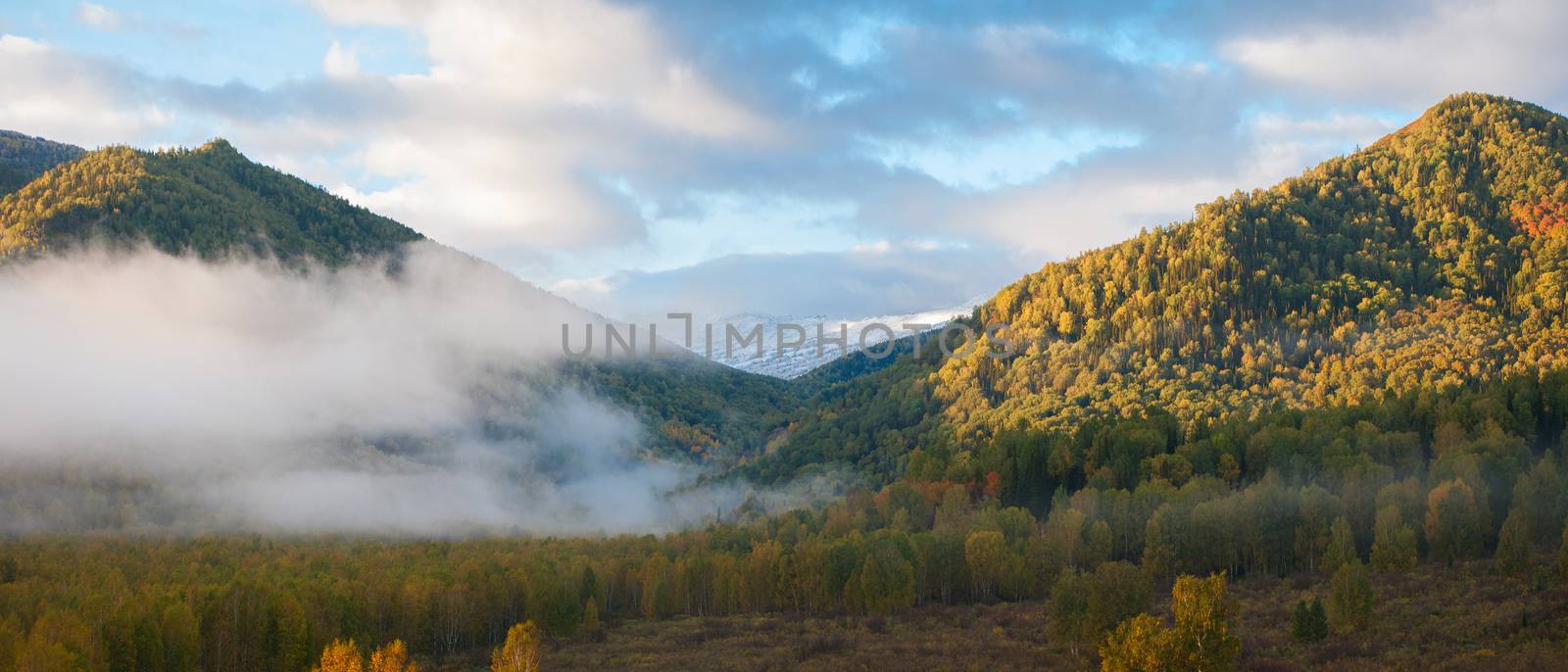 sunrise in autumn taiga and mountains