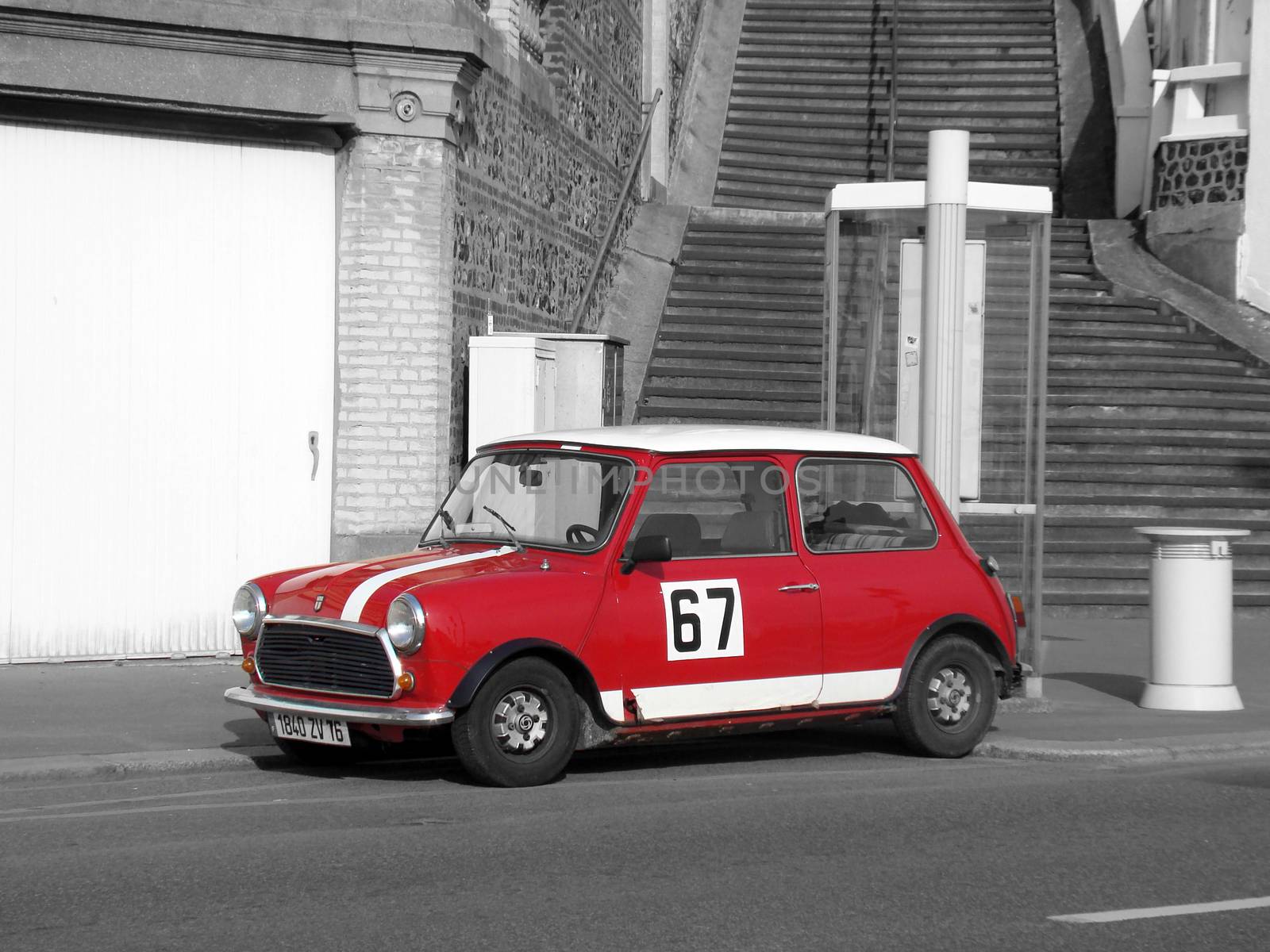 Le Havre, France - May 3 2009:  Mini Cooper Black and White Photography. Red Retro Car Austin Mini Cooper Parked on the Streets of Le Havre in the Normandy region
