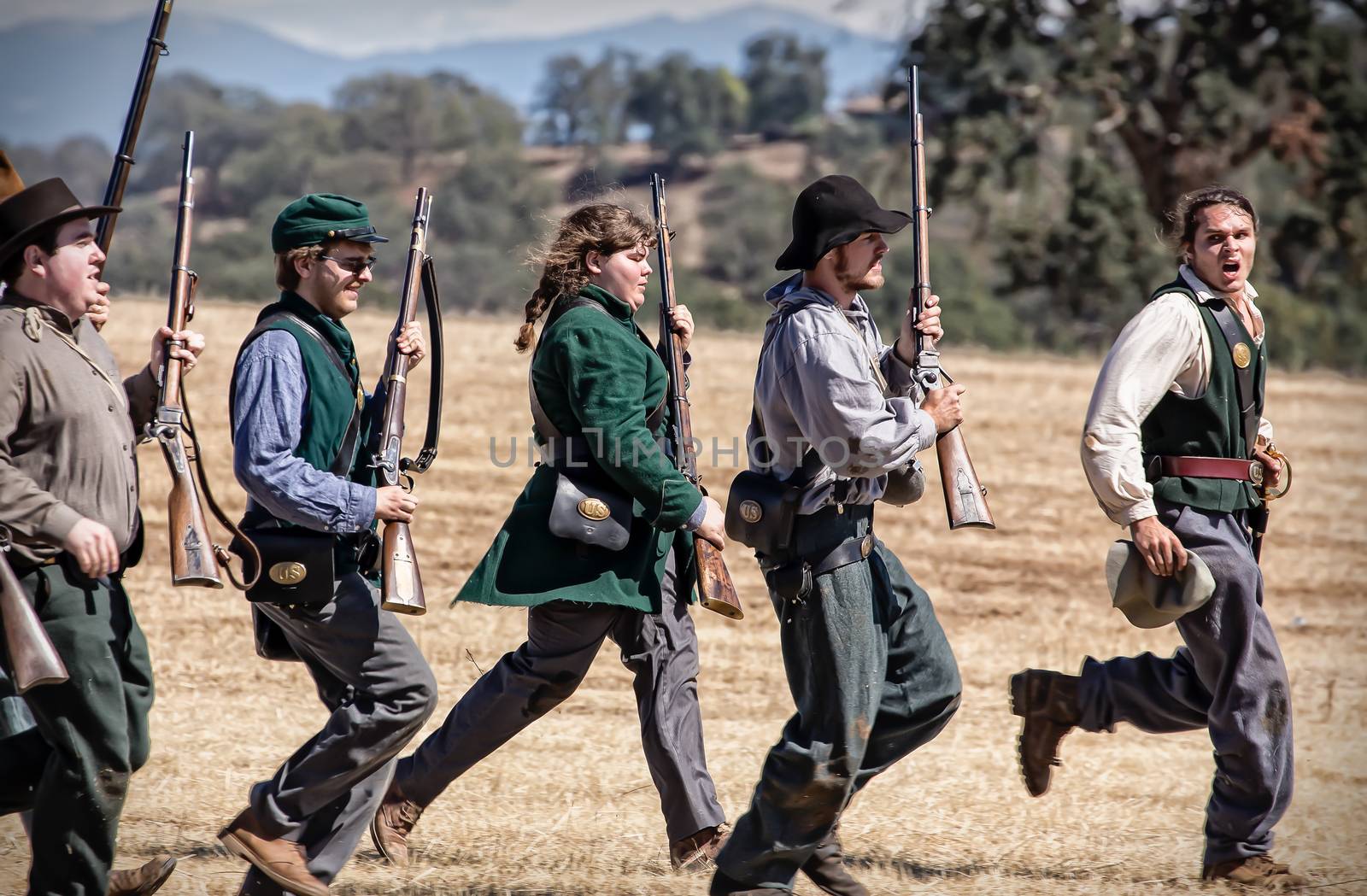Rebel soldiers run to stand ready for combat during a Civil War Reenactment at Anderson, California.
Photo taken on: September 27th, 2014