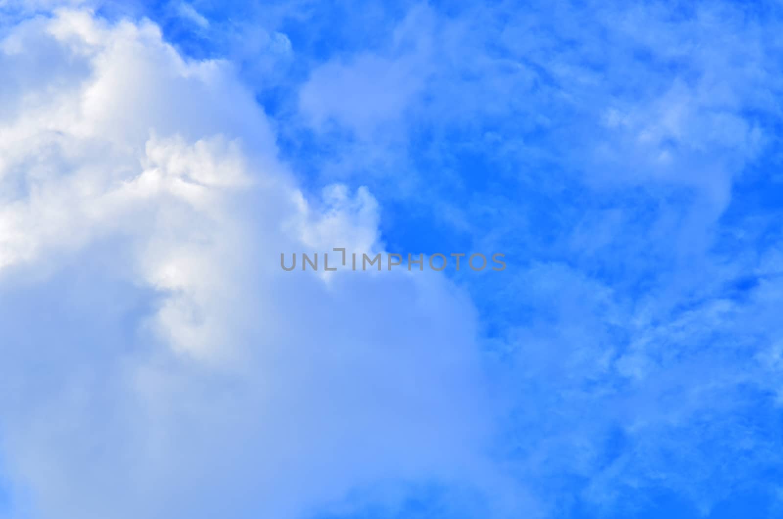 white clouds in the blue sky by raweenuttapong