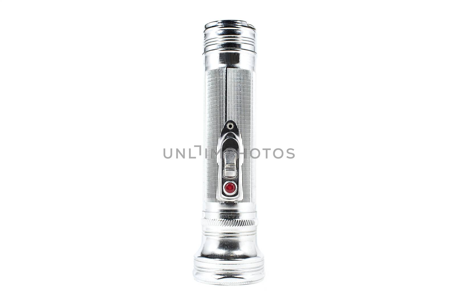 Old-fashioned vintage silver-coloured flashlight on an white background