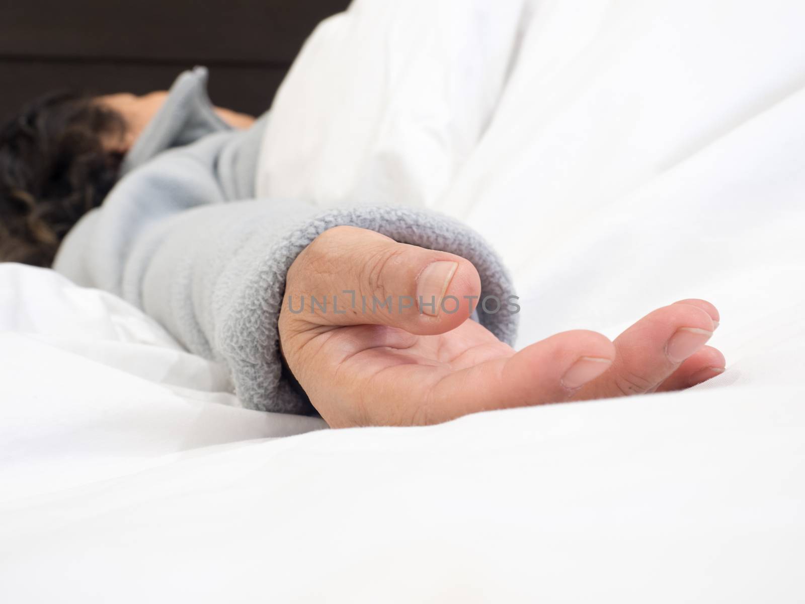 closeup senior woman's hand sleeping in the bed by APTX4869