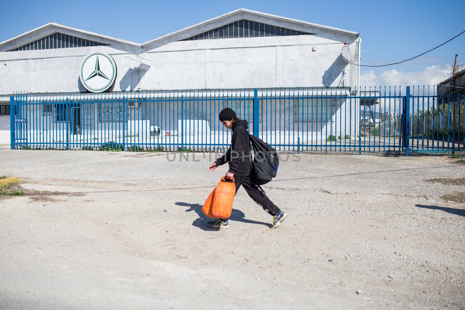 GREECE, Diavata: Migrants walk from Diavata, near Thessaloniki, Greece toward Idomeni border's crossing, on February 25, 2015. Hundreds left Diavata camp, a refugee center near Thessaloniki to reach the Greek-Macedonian border. 