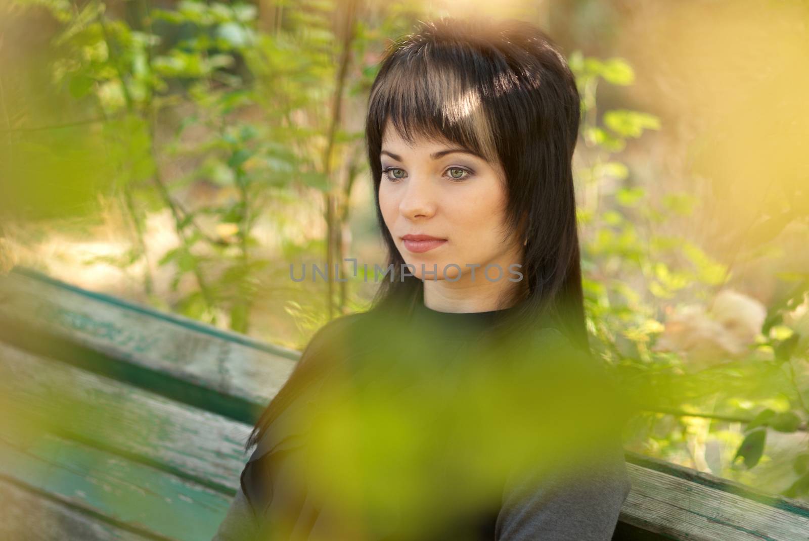 Beautiful girl's portrait with soft autumn background