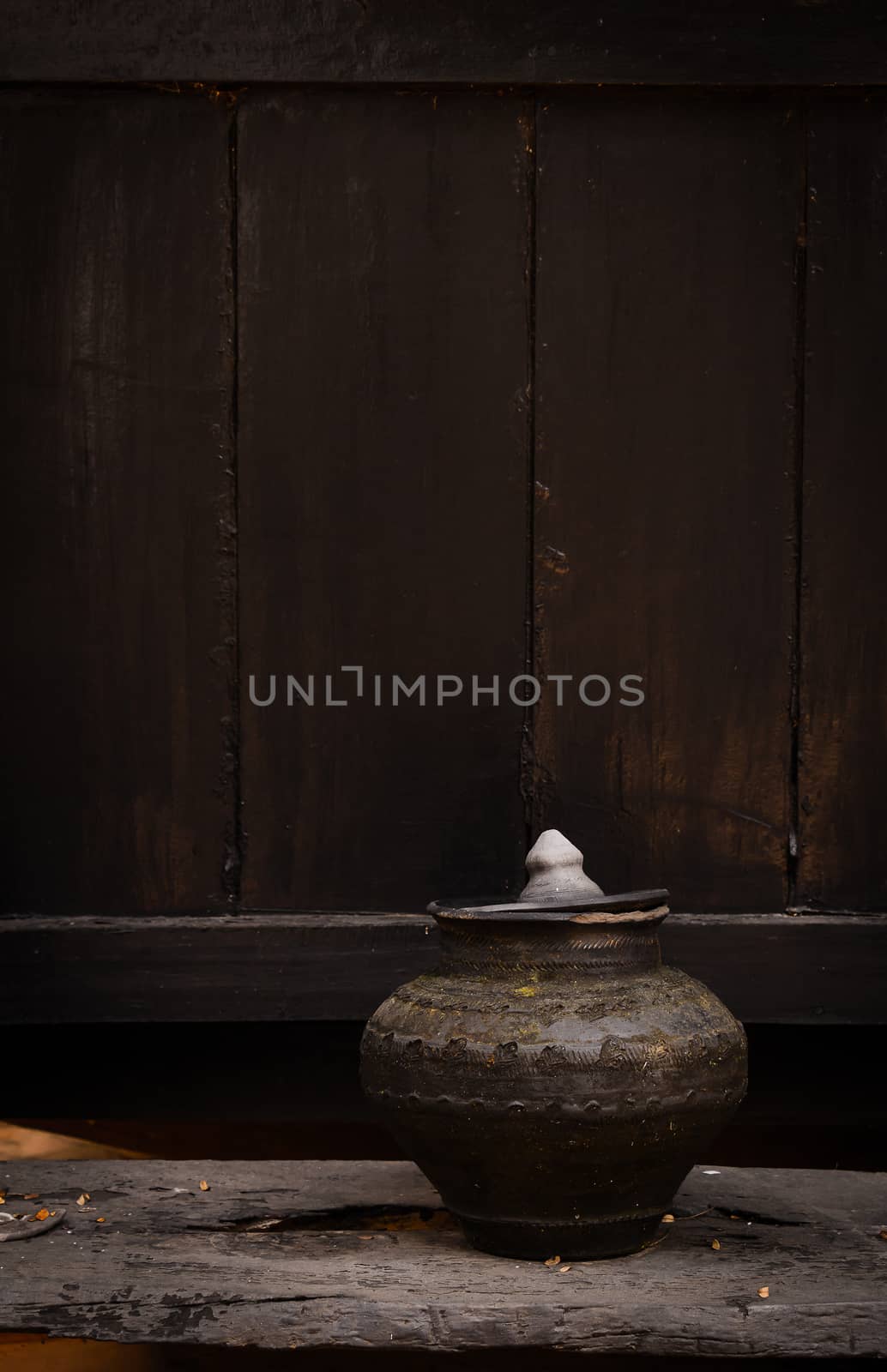 Pottery drinking water jar from northen thailand background