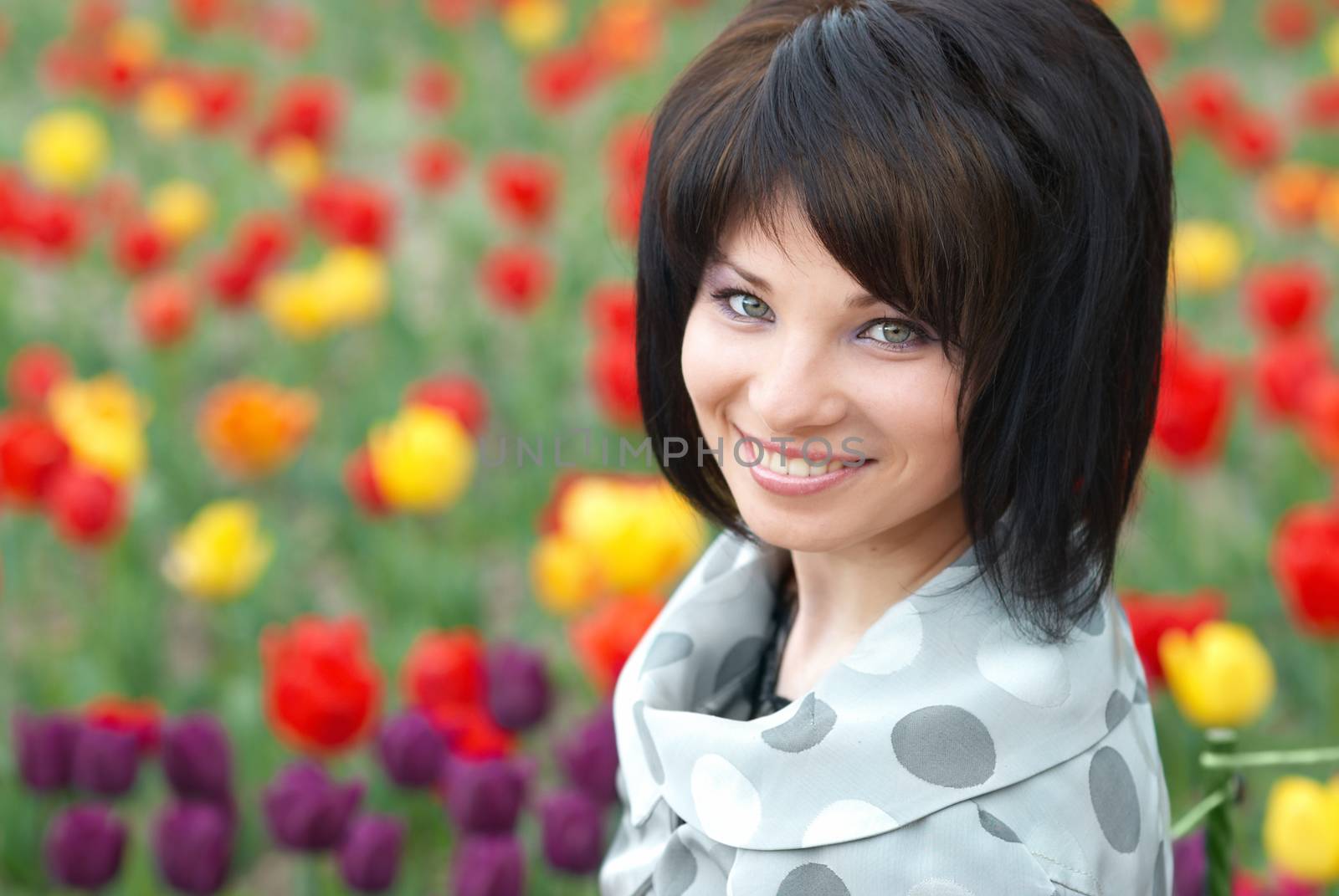 Pretty girl with tulips with soft background