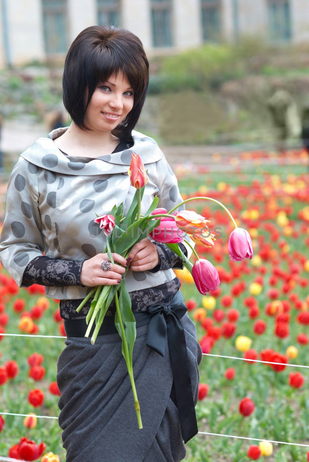 Pretty girl with tulips with soft background