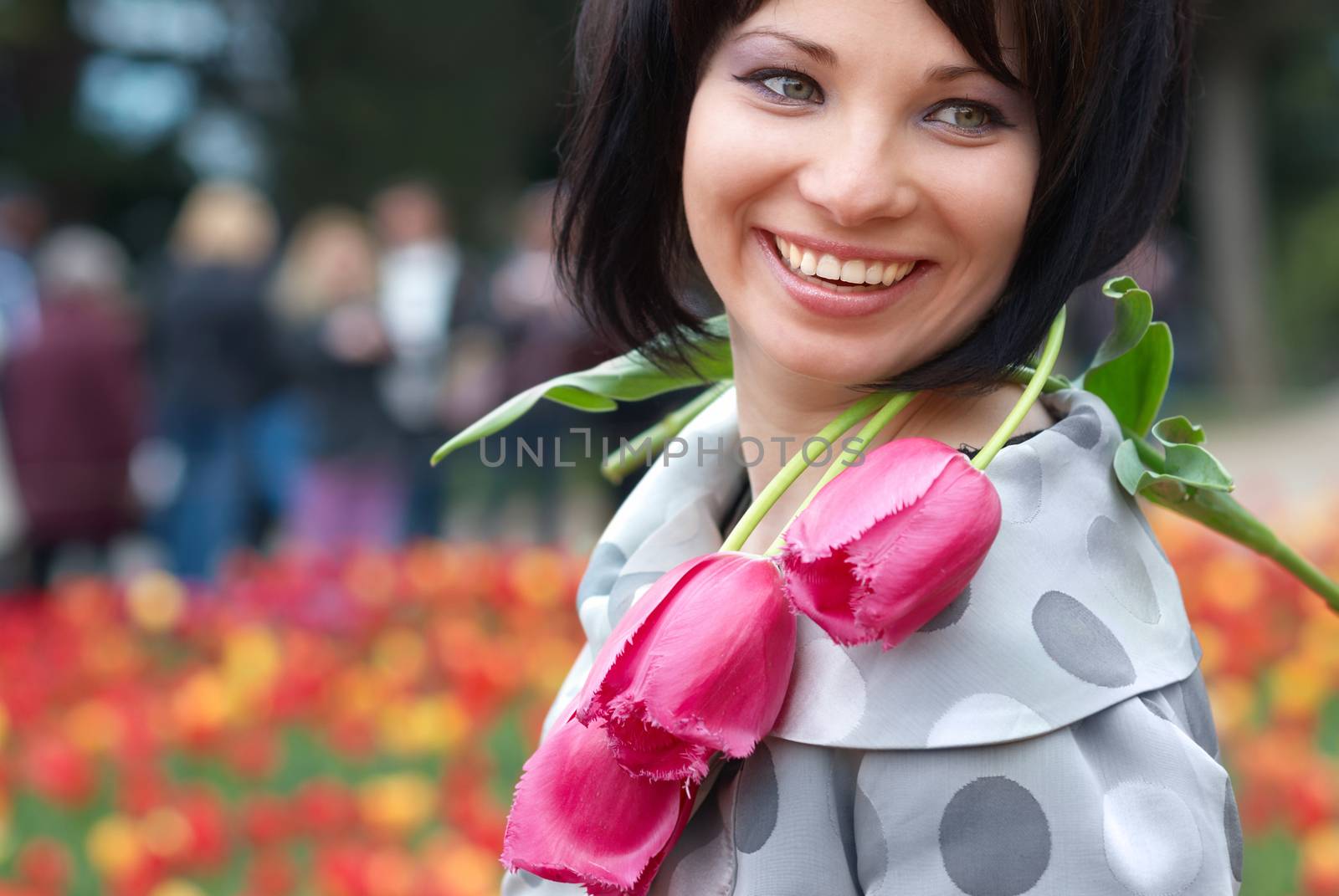 Pretty girl with tulips with soft background