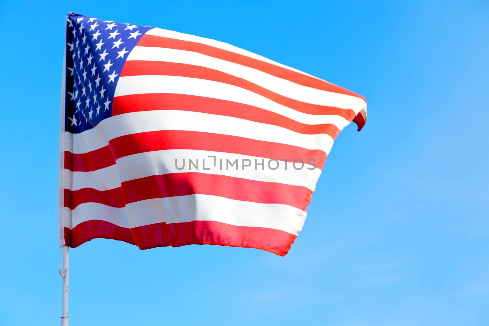 waving flag in the blue sky  usa   colour and wave