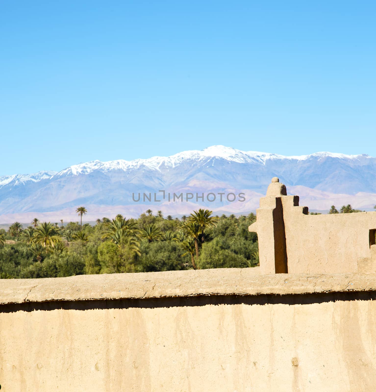 brown old  construction in  africa morocco and  clouds  near the tower 