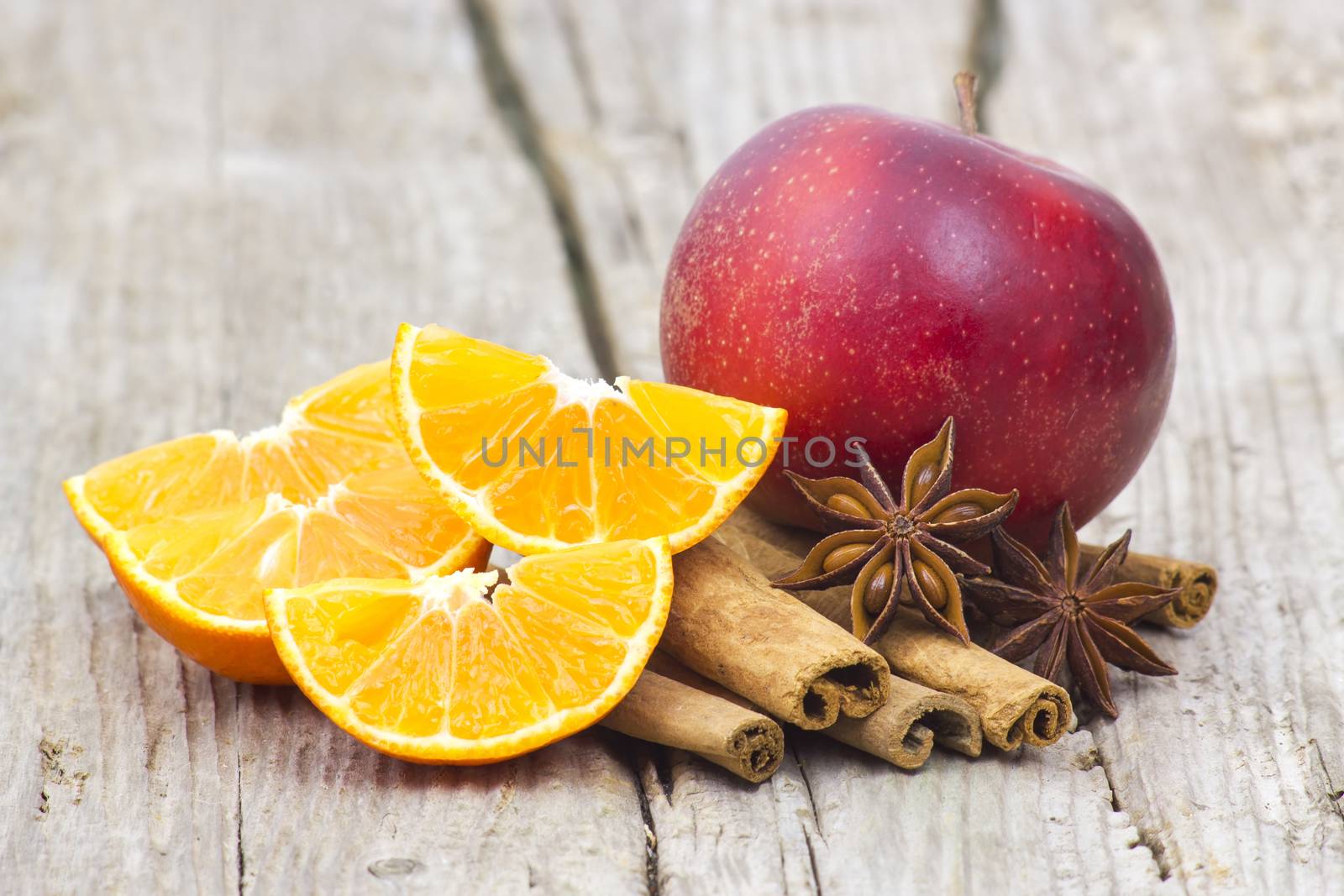 fruits and spises on wooden background by miradrozdowski