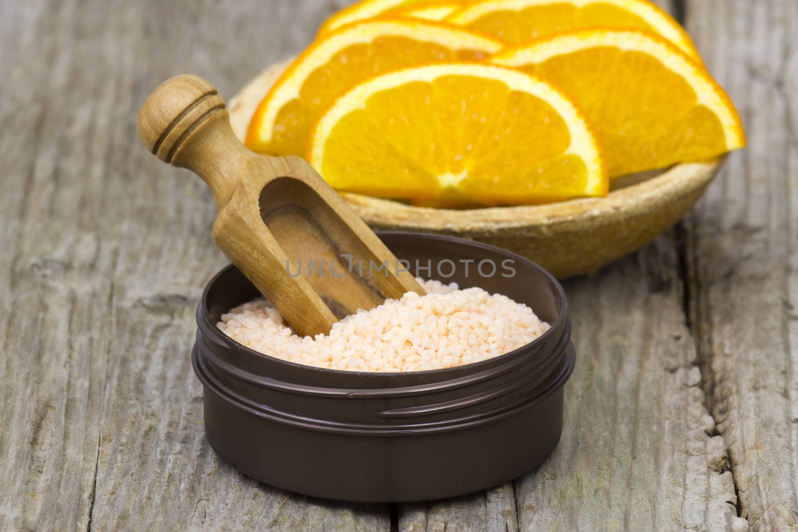 orange bath salt and fresh fruits - beauty treatment