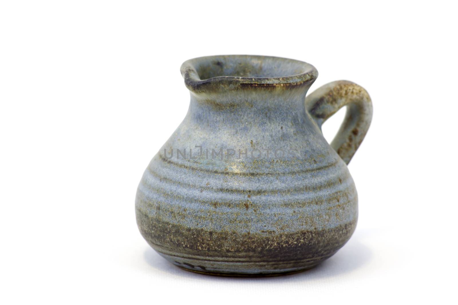 Clay jug, old ceramic vase isolated on white background