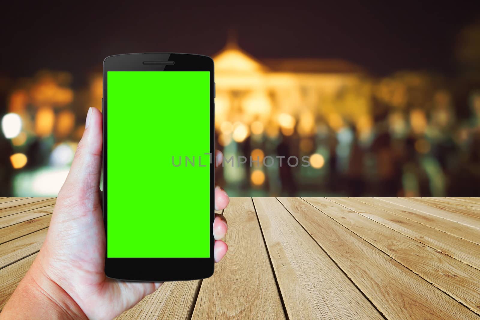 Modern mobile phone in the hand,on blur background image 