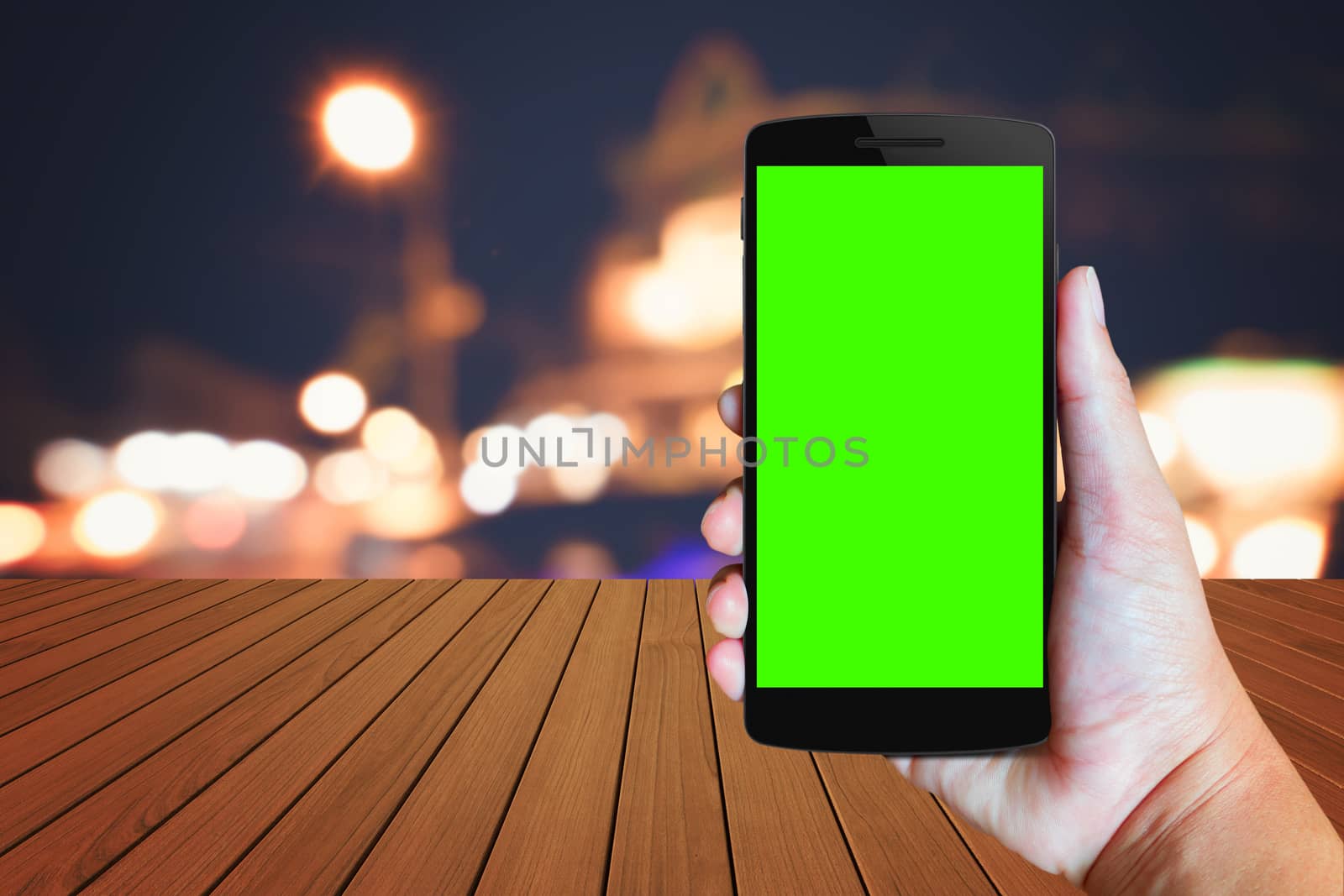 Modern mobile phone in the hand,on blur background image 