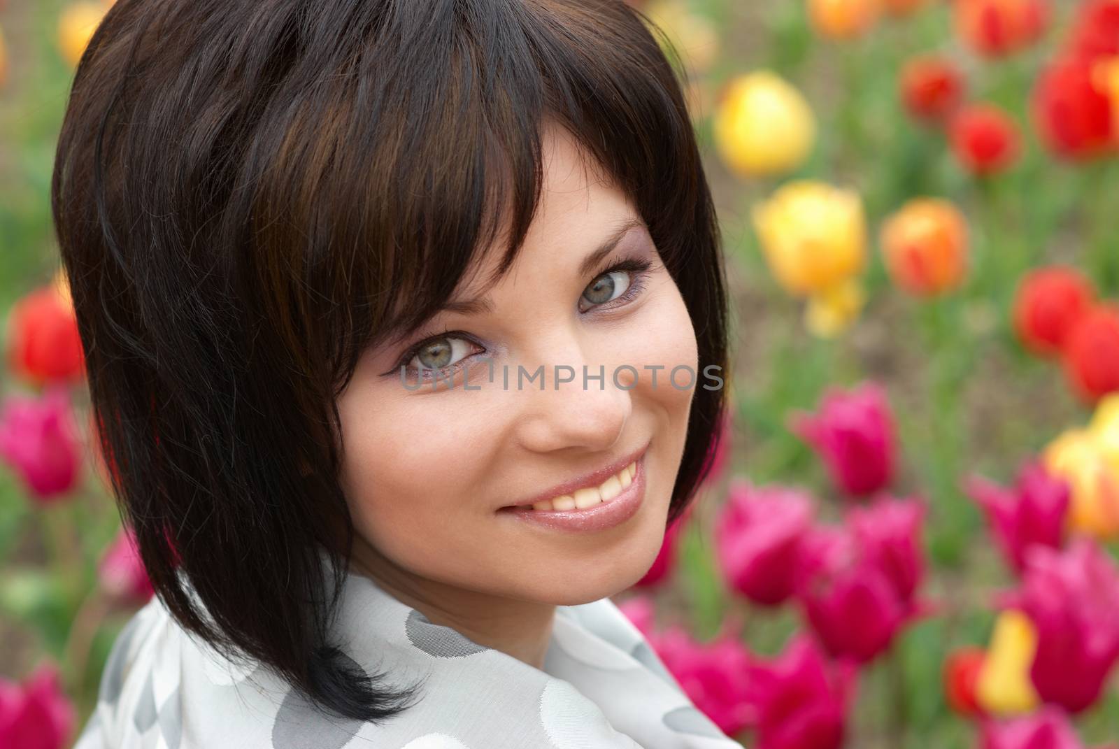 Pretty girl with tulips with soft background