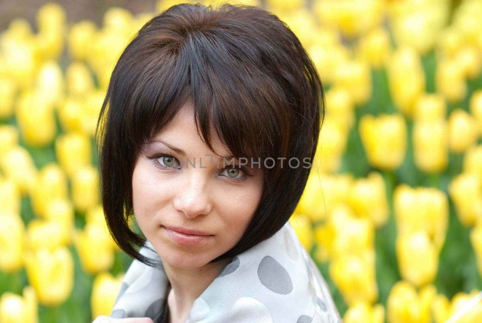 Pretty girl with tulips with soft background