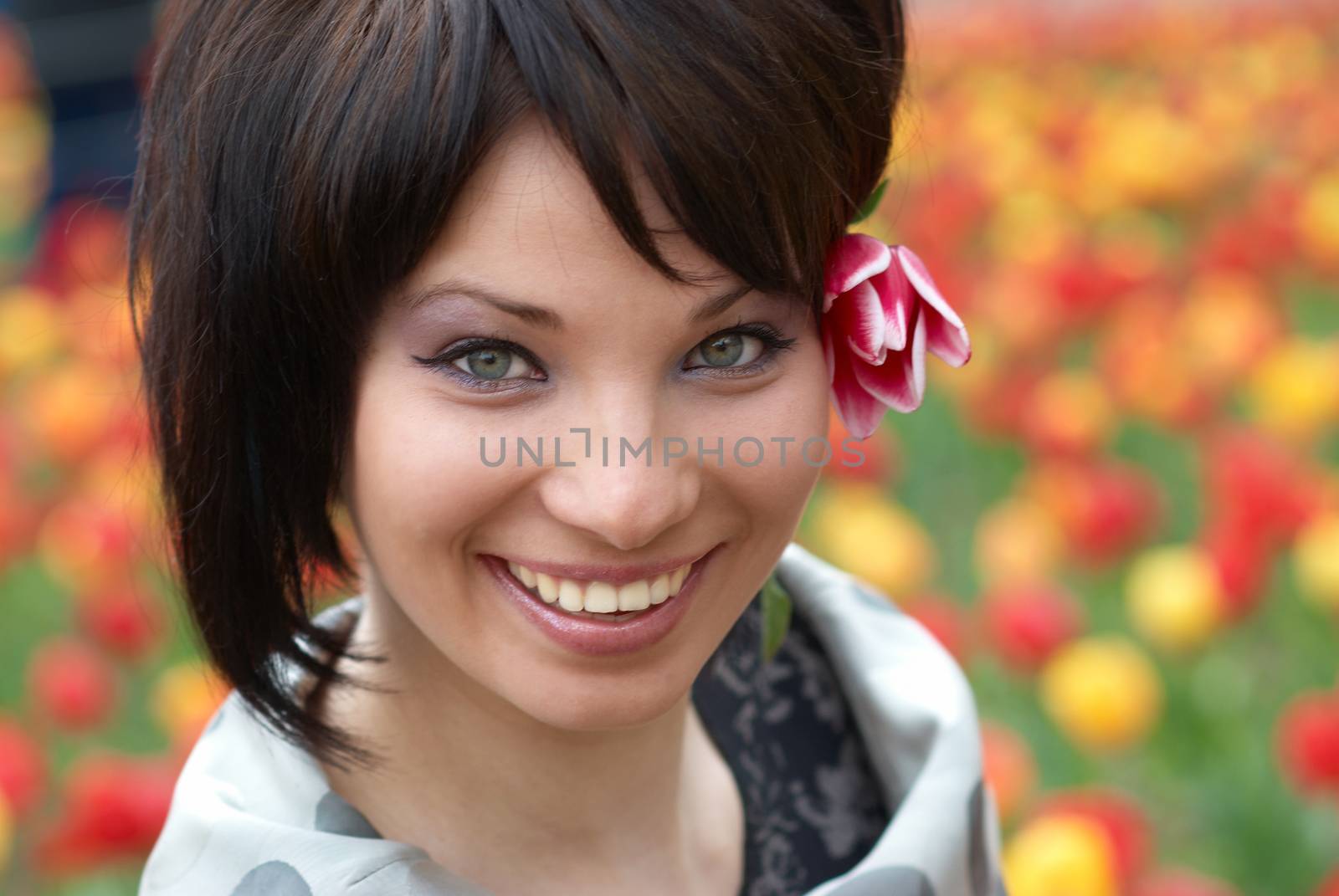 Pretty girl with tulips with soft background