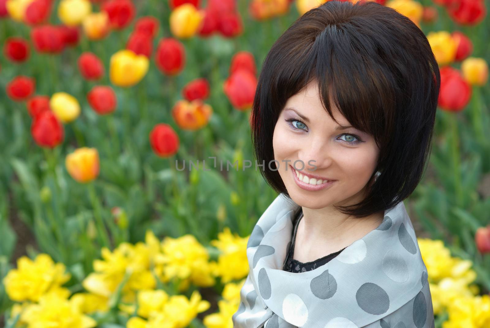 Pretty girl with tulips with soft background