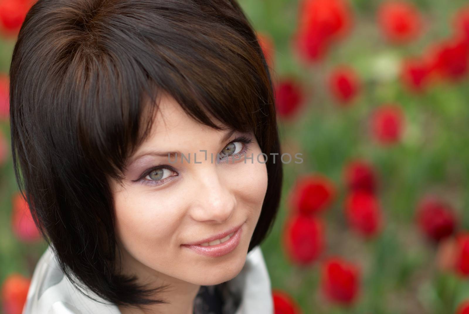 Pretty girl with tulips with soft background