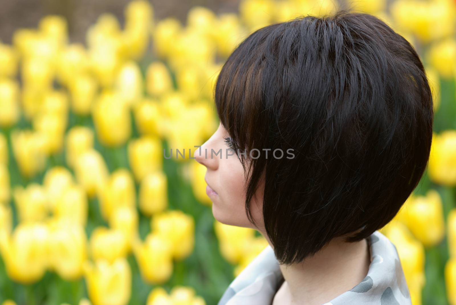 Pretty girl with tulips with soft background