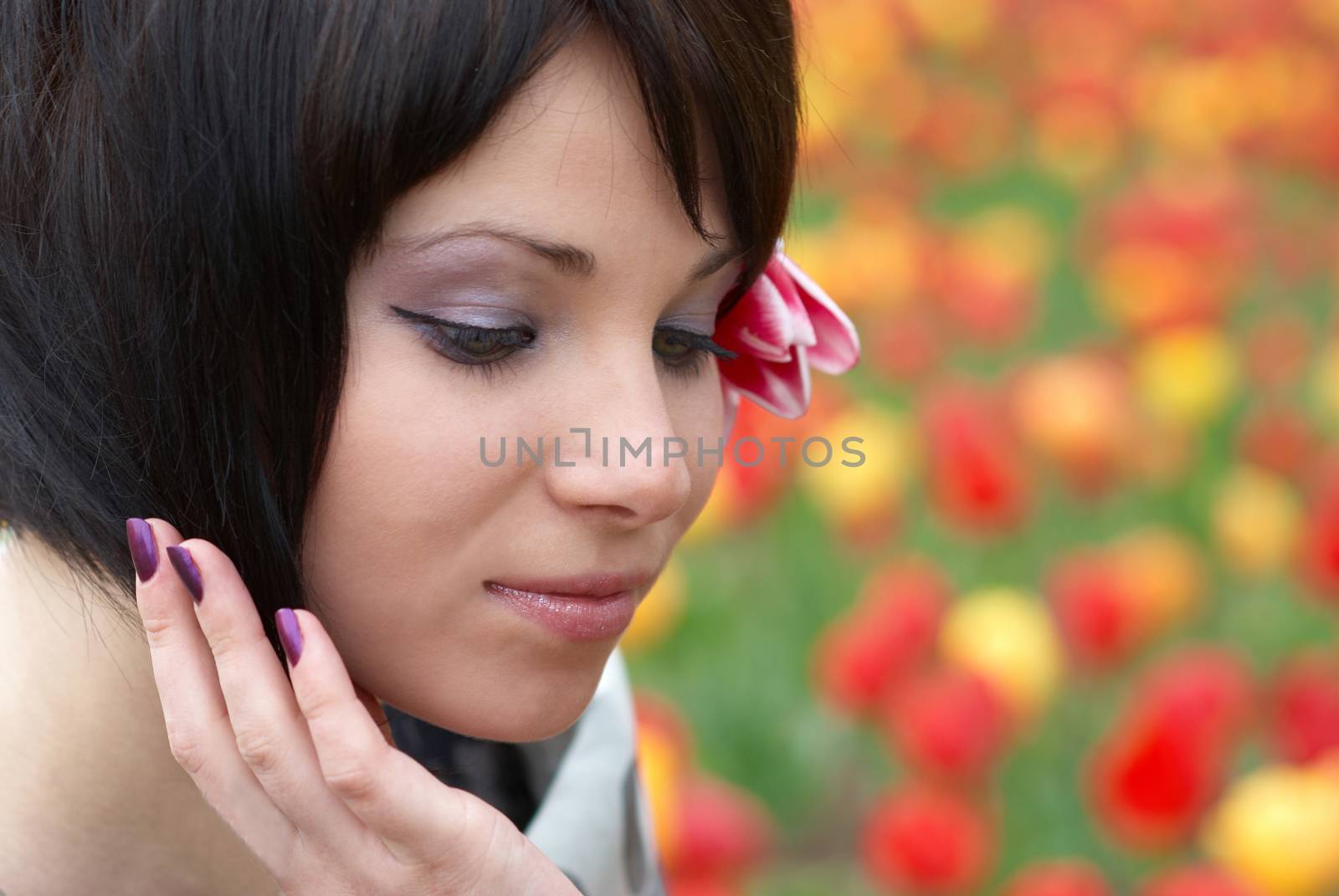 Pretty girl with tulips with soft background