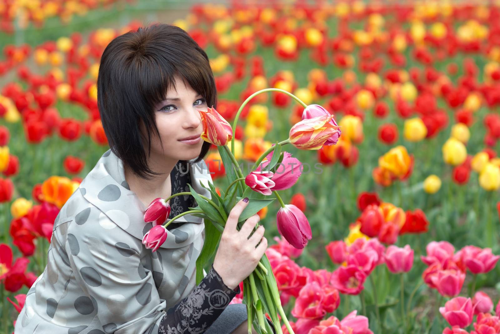 Pretty girl with tulips with soft background