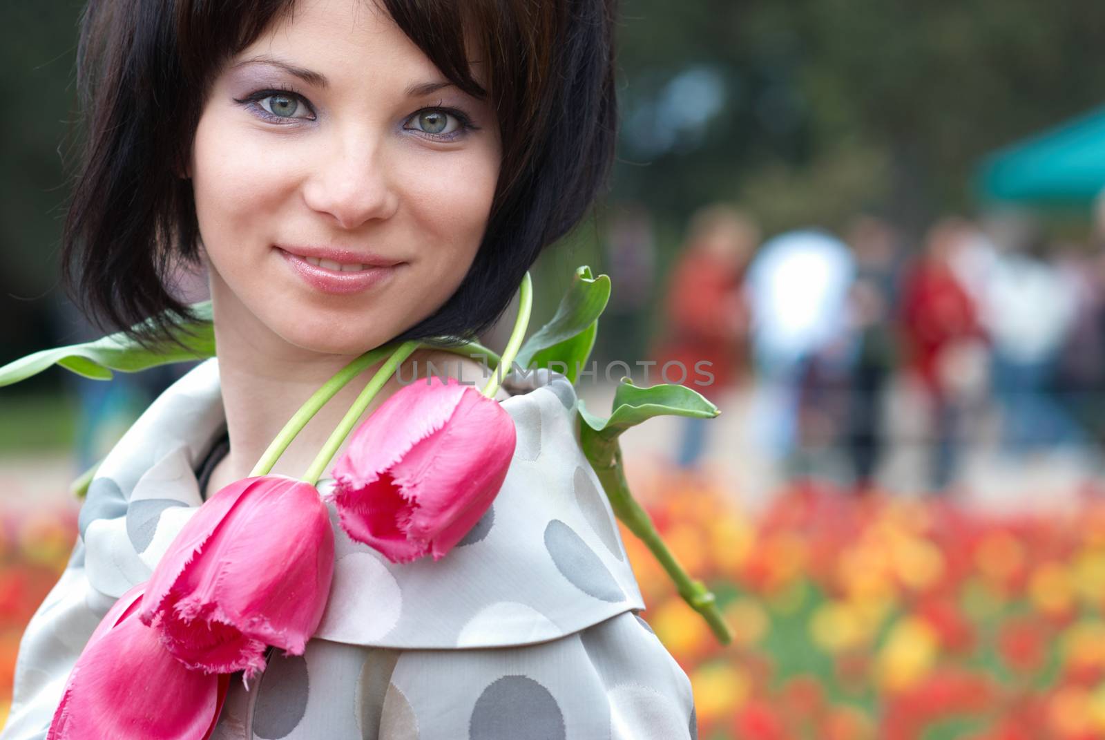 Pretty girl with tulips with soft background