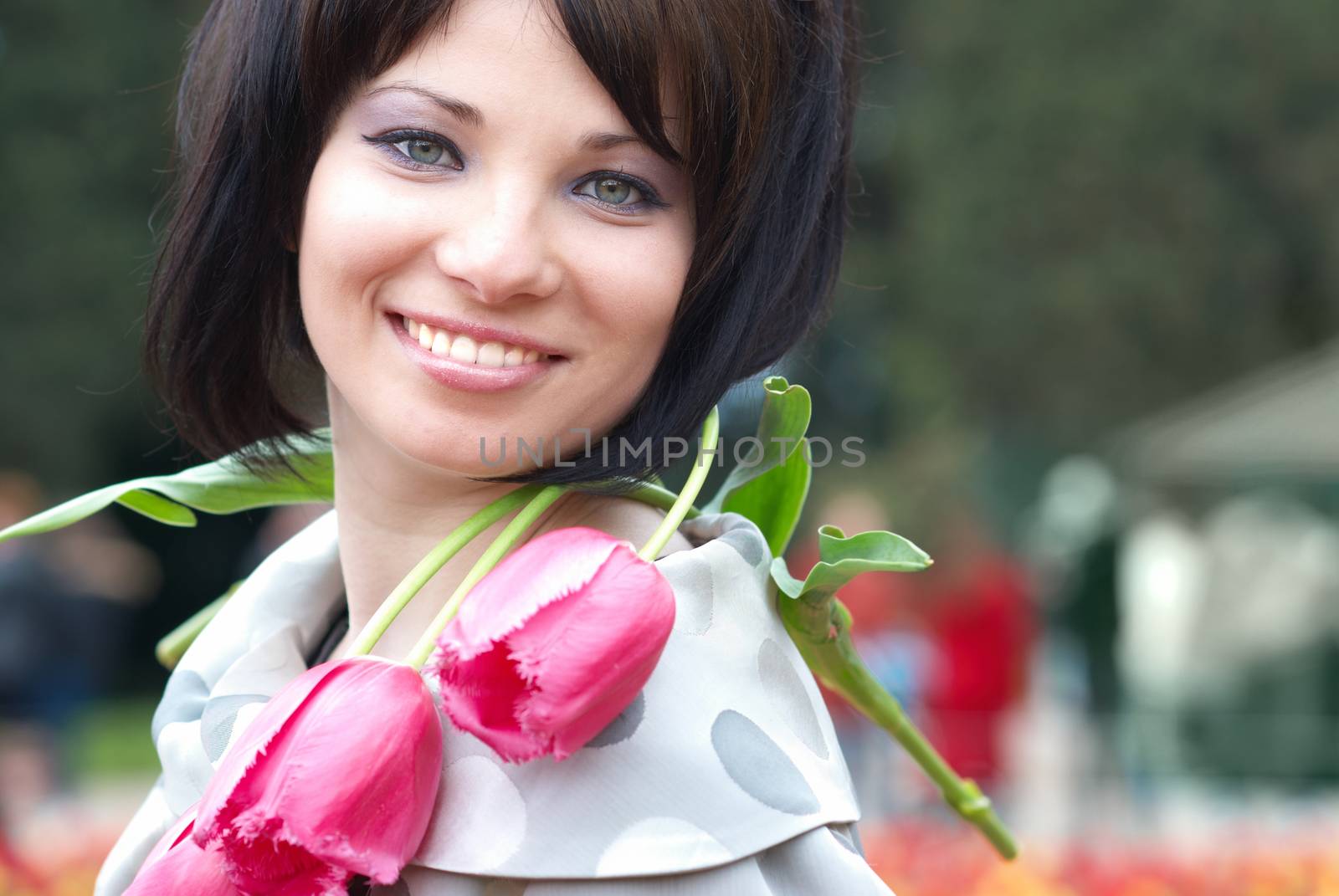 Pretty girl with tulips with soft background