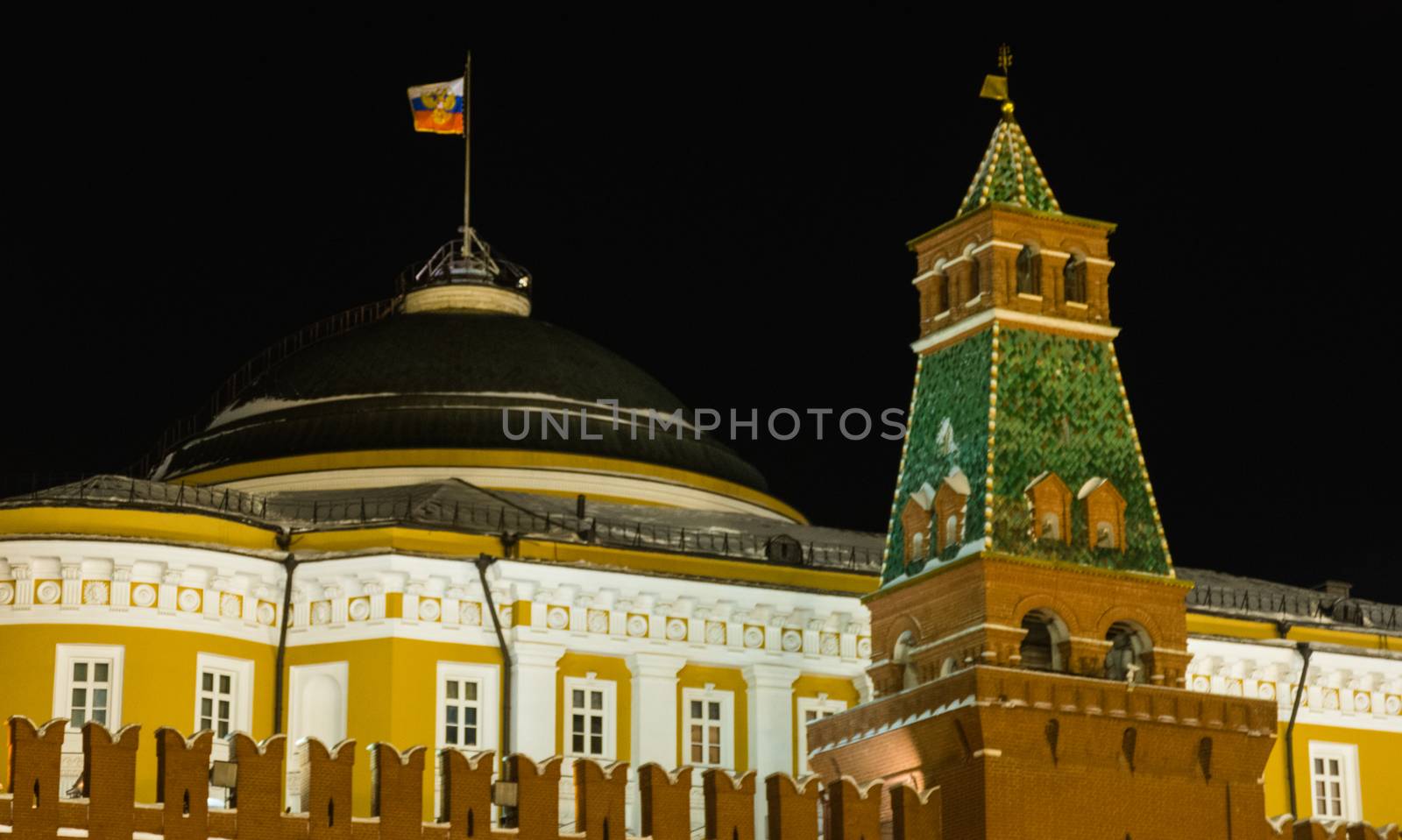 Kremlin in Moscow at night in the winter and Russian flag 2016