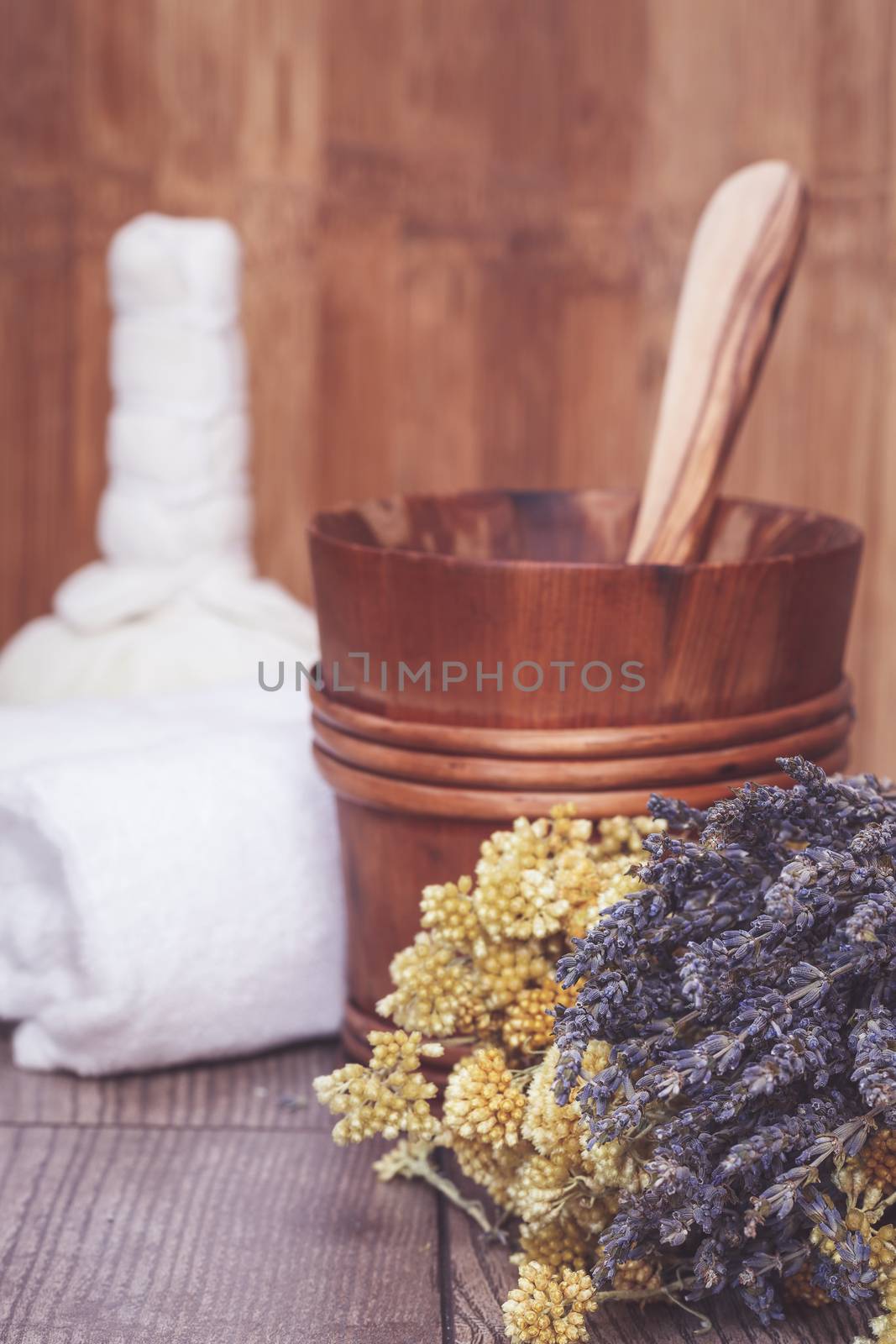 Herbal compress balls for spa treatment and lavender. Macro selective focus with retro style processing, blank space
