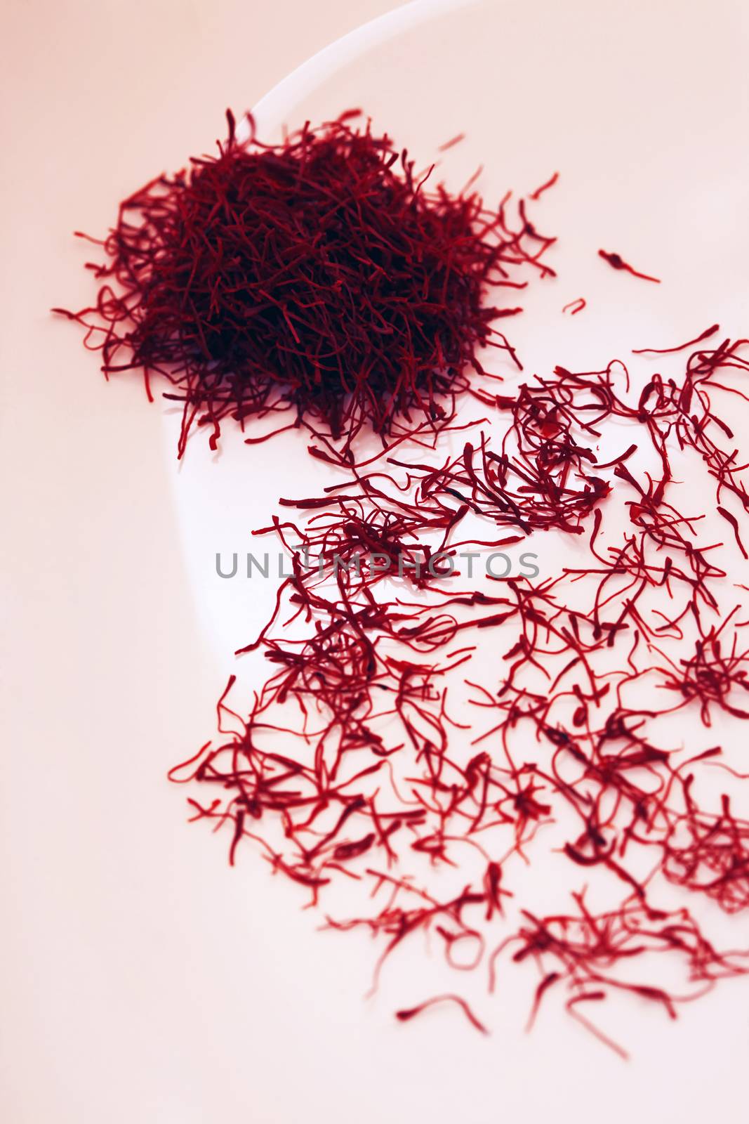 Heap saffron isolated on pink background