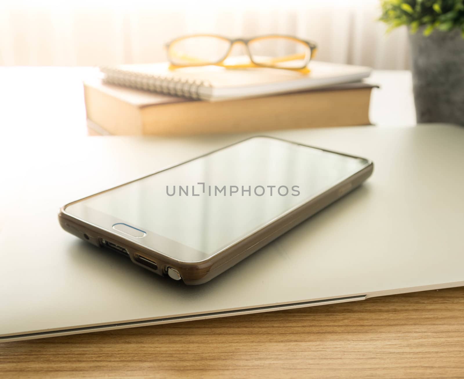 smart phone on work desk. technology concept