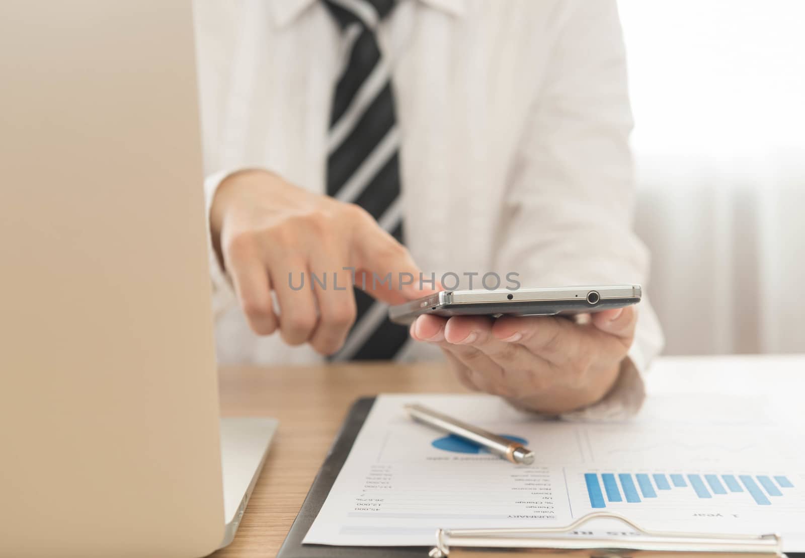 businessman to using smartphone at office. selective focus