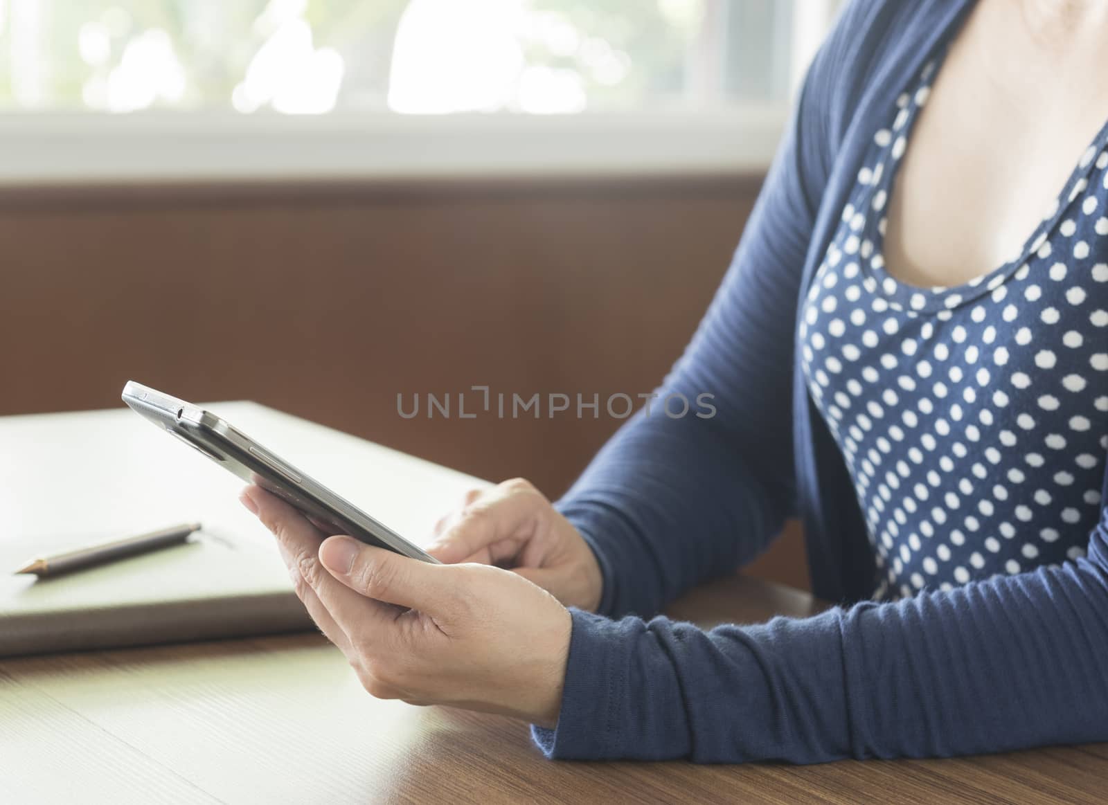 closeup woman using smart phone at home.