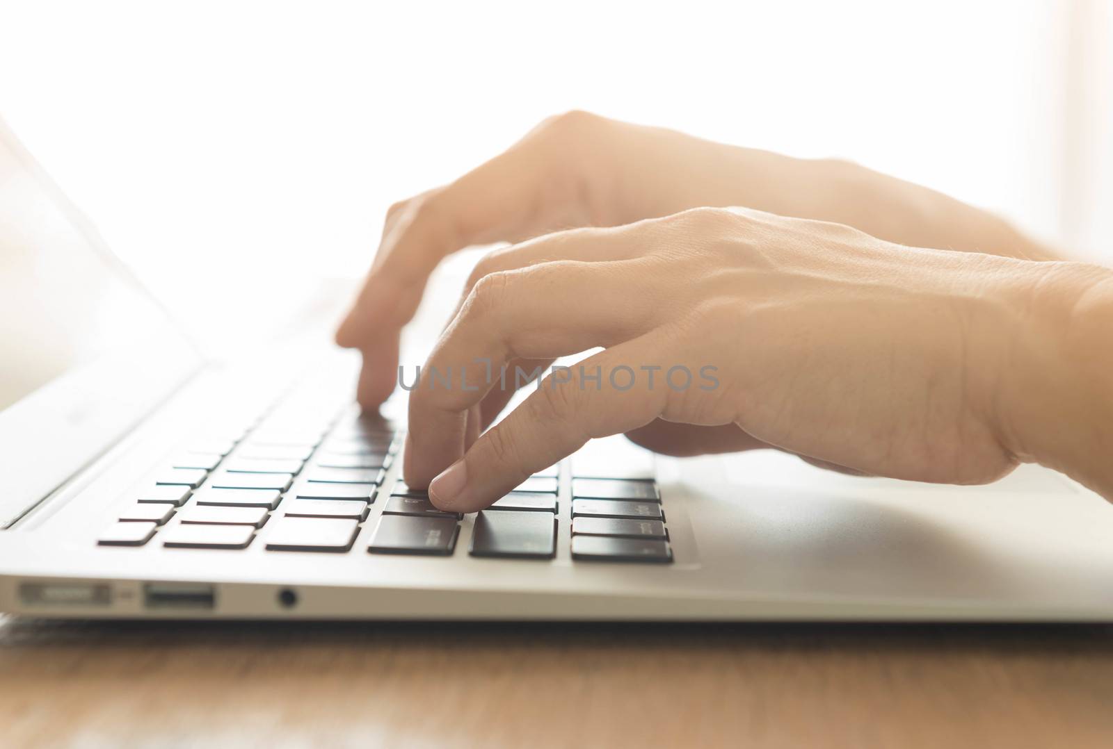 closeup a hands typing on laptop keyboard.